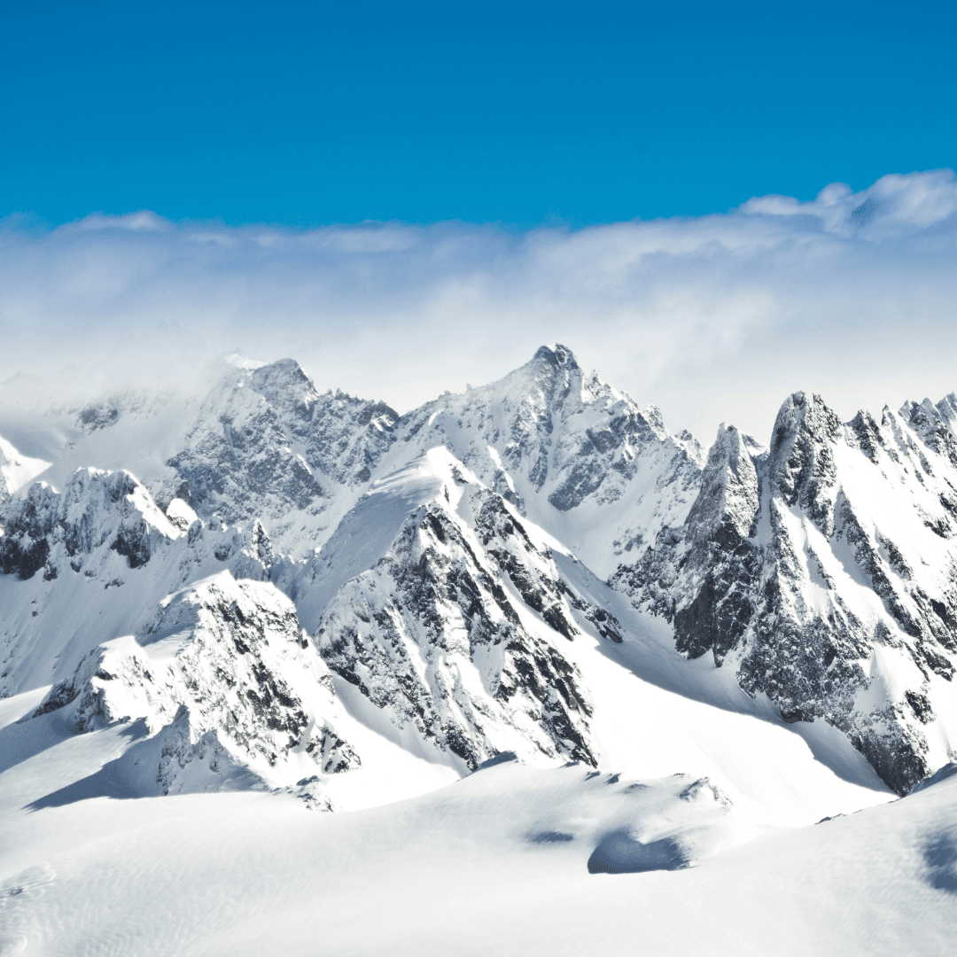 Majestic snow-covered peaks of the Swiss Alps under a clear blue sky