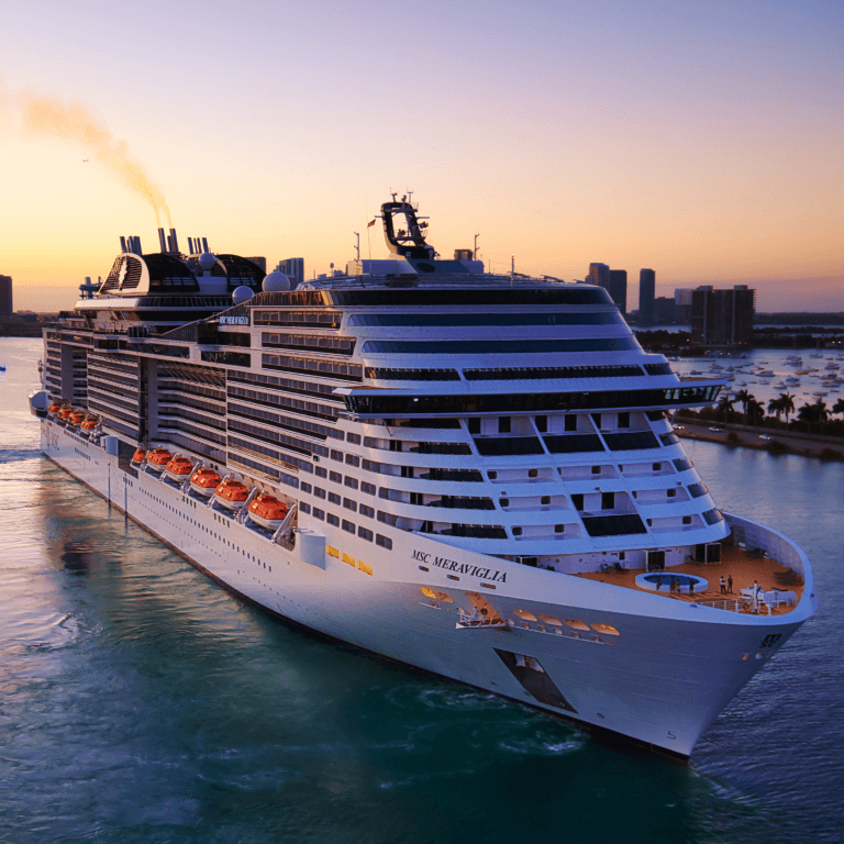 A large cruise ship sailing peacefully across the ocean, highlighting the importance of smart packing tips for cruise vacations.