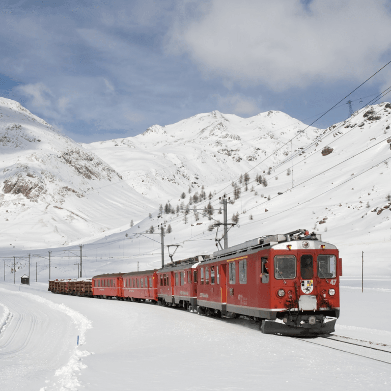 best places to visit in February: Scenic train journeys through snowy mountain destinations in Europe.