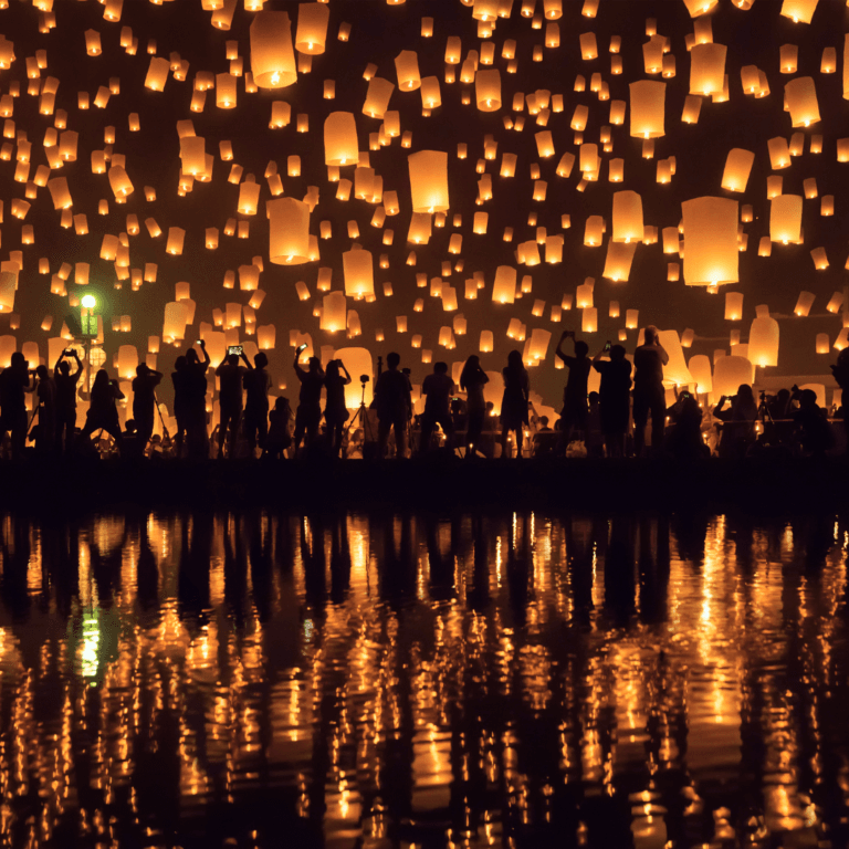 Thousands of glowing lanterns floating into the night sky during the Chiang Mai Light Festival, with silhouettes of people releasing them into the air.