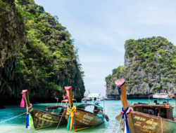 Wooden boats on a beautiful beach with clear water in Asia